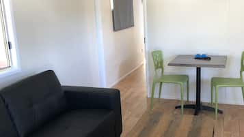 Comfort Cabin, 1 Bedroom, Balcony | Living area | Flat-screen TV, table tennis