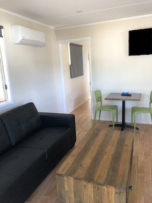 Comfort Cabin, 1 Bedroom, Balcony | Living area | Flat-screen TV, table tennis - Homestead Caravan Park (Nanango)