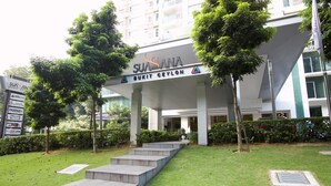 A modern building with a sign reading "SUSANA BUKIT GEYLON".