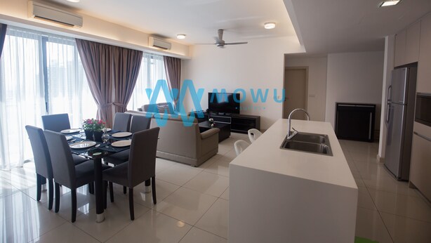 A modern living room with a dining area, a kitchen, and a TV.