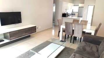 Apartment, 2 Bedrooms | Living area | 42-inch Smart TV with satellite channels, TV