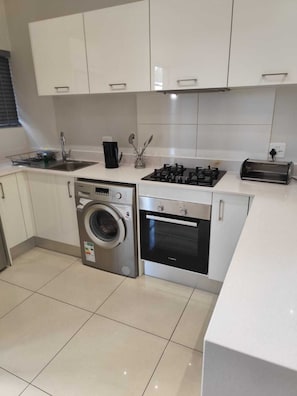 Apartment, 2 Bedrooms | Private kitchen | Full-size fridge, microwave, oven, stovetop