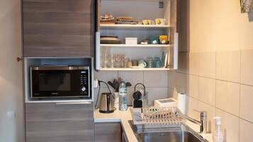 Standard Double Room | Private kitchen | Fridge, microwave, oven, coffee/tea maker