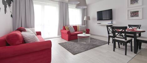 Appartement Standard, 1 chambre | Salle de séjour | Télévision à écran plat