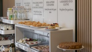 A breakfast buffet with labeled sections for energy, vegan, gluten-free, and dairy-free options. - Hotel Ungheria Varese 1946 (Varese)