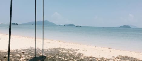 On the beach, sun-loungers, beach towels