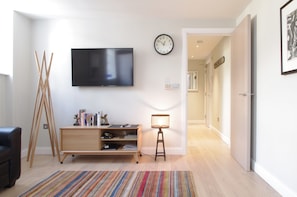 Apartment, 1 Bedroom | Living room | Flat-screen TV