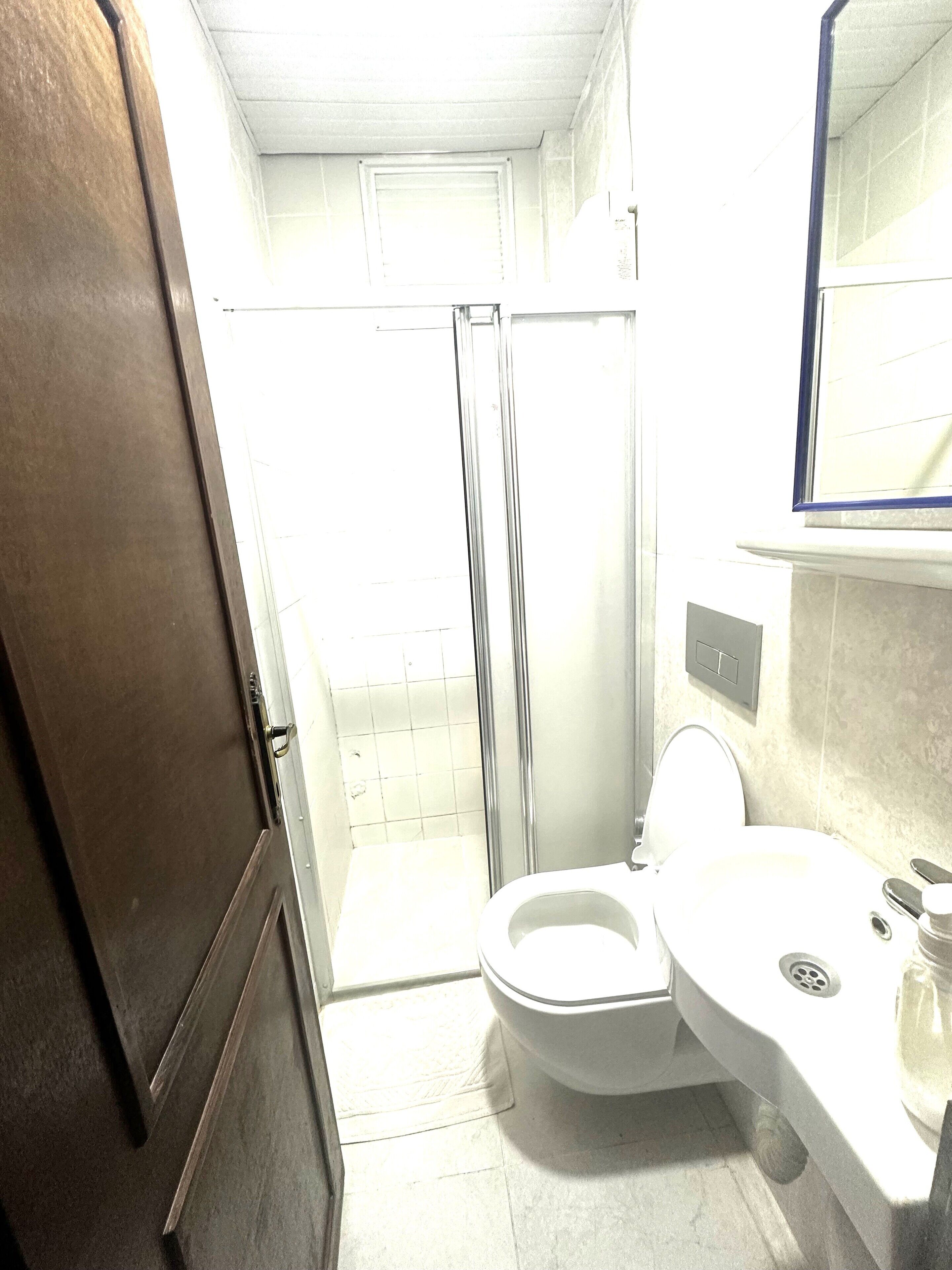 Single Room | Bathroom | Shower, free toiletries, hair dryer, slippers