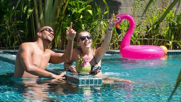 Outdoor pool, an infinity pool, open 6 AM to 10 PM, pool umbrellas