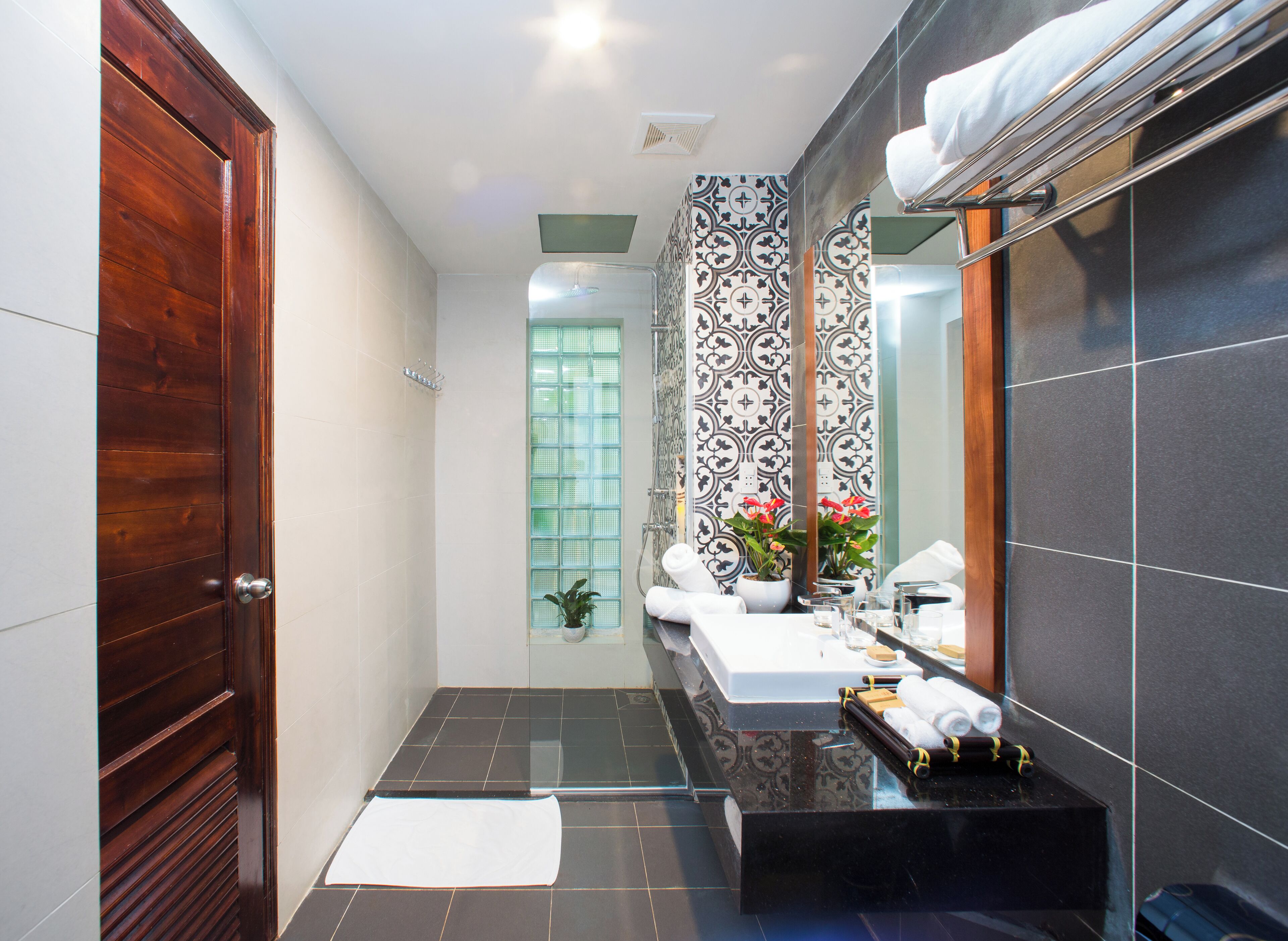 designer toiletries, hair dryer, bathrobes, slippers