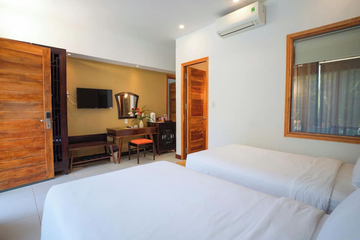 Family Suite, 2 Bedrooms, Pool View, Poolside | Minibar, in-room safe, blackout drapes, soundproofing