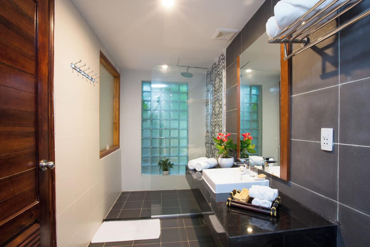 designer toiletries, hair dryer, bathrobes, slippers