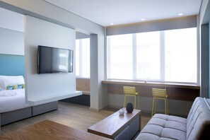 Suite (The K29) | Living area | 40-inch flat-screen TV with cable channels, TV - Athenaeum K 29 Hotel (Athens)