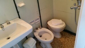 A bathroom with a sink, toilet, and shower. - Hotel Perla Del Este (La Paloma)