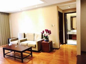 Family Triple Room | Living area | LCD TV