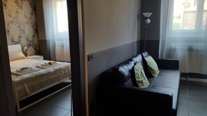 Apartment, 1 Bedroom | Living area | Flat-screen TV