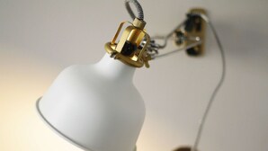 A white desk lamp with a metallic base and cord. - The London Agent Fitzrovia Studio 1 (London)