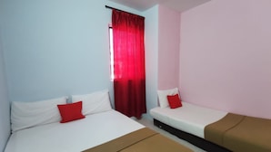 A room with two beds, one with white bedding and the other with brown bedding, and a window with red curtains. - OYO 90086 My Seven Days Inn (Masai)