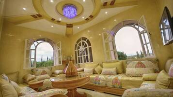 Comfort Villa, 4 Bedrooms | Living area | 50-inch flat-screen TV with satellite channels, TV