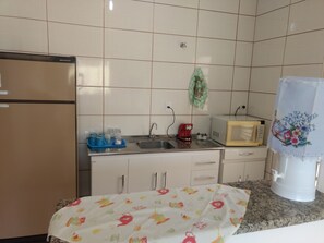 Fridge, microwave, blender, cookware/dishes/utensils