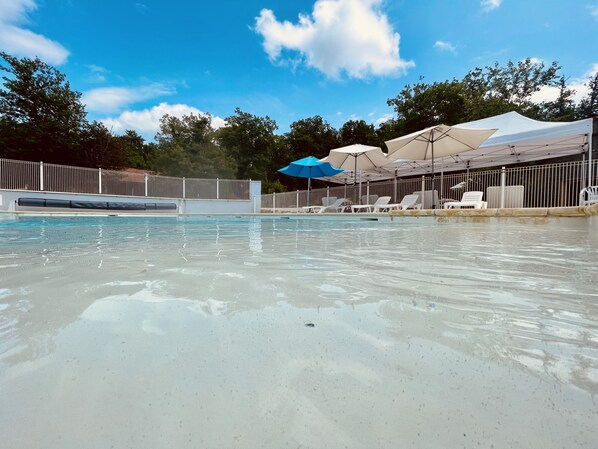 Outdoor pool, a heated pool, pool loungers