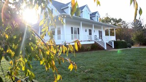 A two-story house with a front porch and a staircase leading to the entrance. - In the center of Nelson County's wine and beer region, 19 miles to UVA/Cville (Afton)
