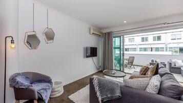 Apartment, 1 Bedroom | Living area | 50-inch flat-screen TV with digital channels, TV, Netflix