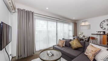 Apartment, 1 Bedroom | Living area | 50-inch flat-screen TV with digital channels, TV, Netflix