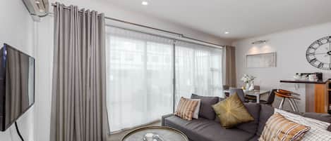 Apartment, 1 Bedroom | Living area | 50-inch flat-screen TV with digital channels, TV, Netflix