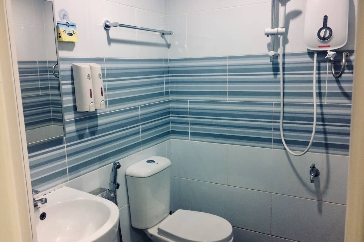 deluxe room, 1 king bed | bathroom | shower, free toiletries, hair dryer, slippers