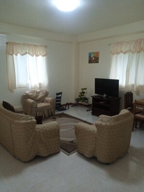 Family Apartment | Living area | Flat-screen TV - Sabang Oasis Resort (Puerto Galera)