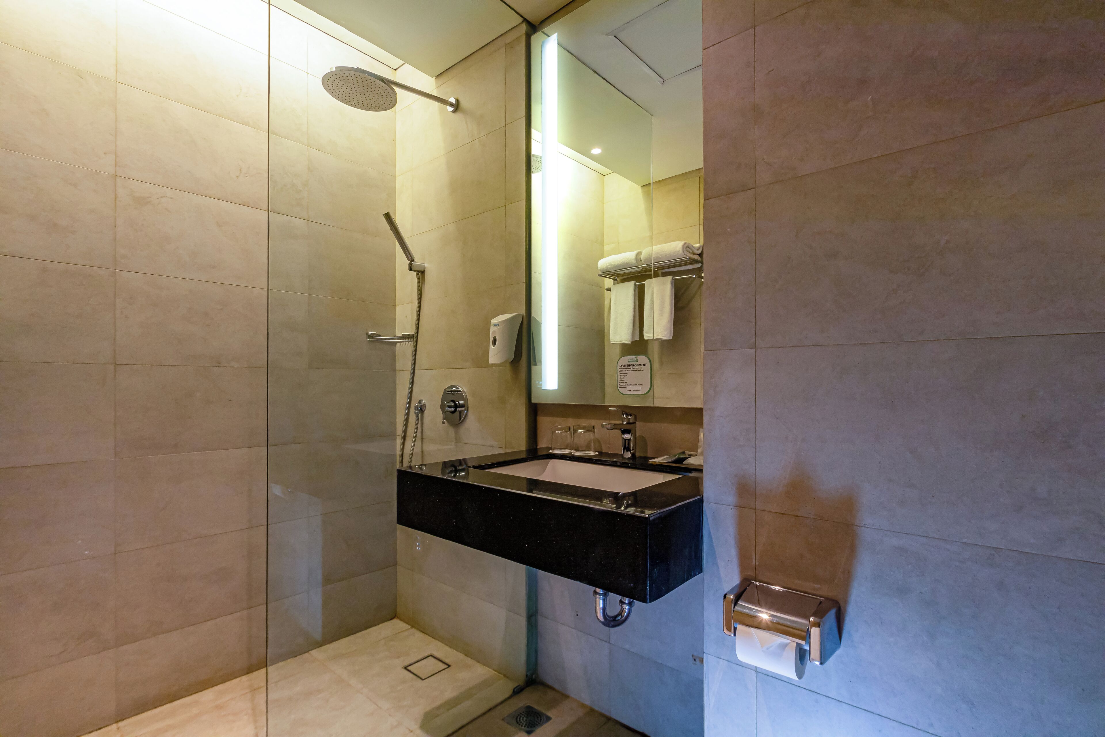 junior suite | bathroom | shower, free toiletries, slippers, towels