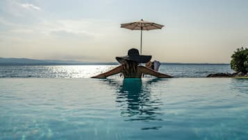 Indoor pool, outdoor pool, pool umbrellas, pool loungers