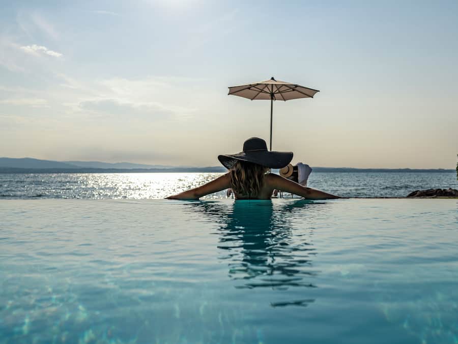 Indoor pool, outdoor pool, pool umbrellas, pool loungers