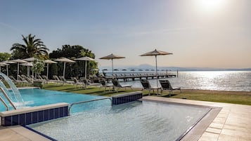 Indoor pool, outdoor pool, pool umbrellas, pool loungers