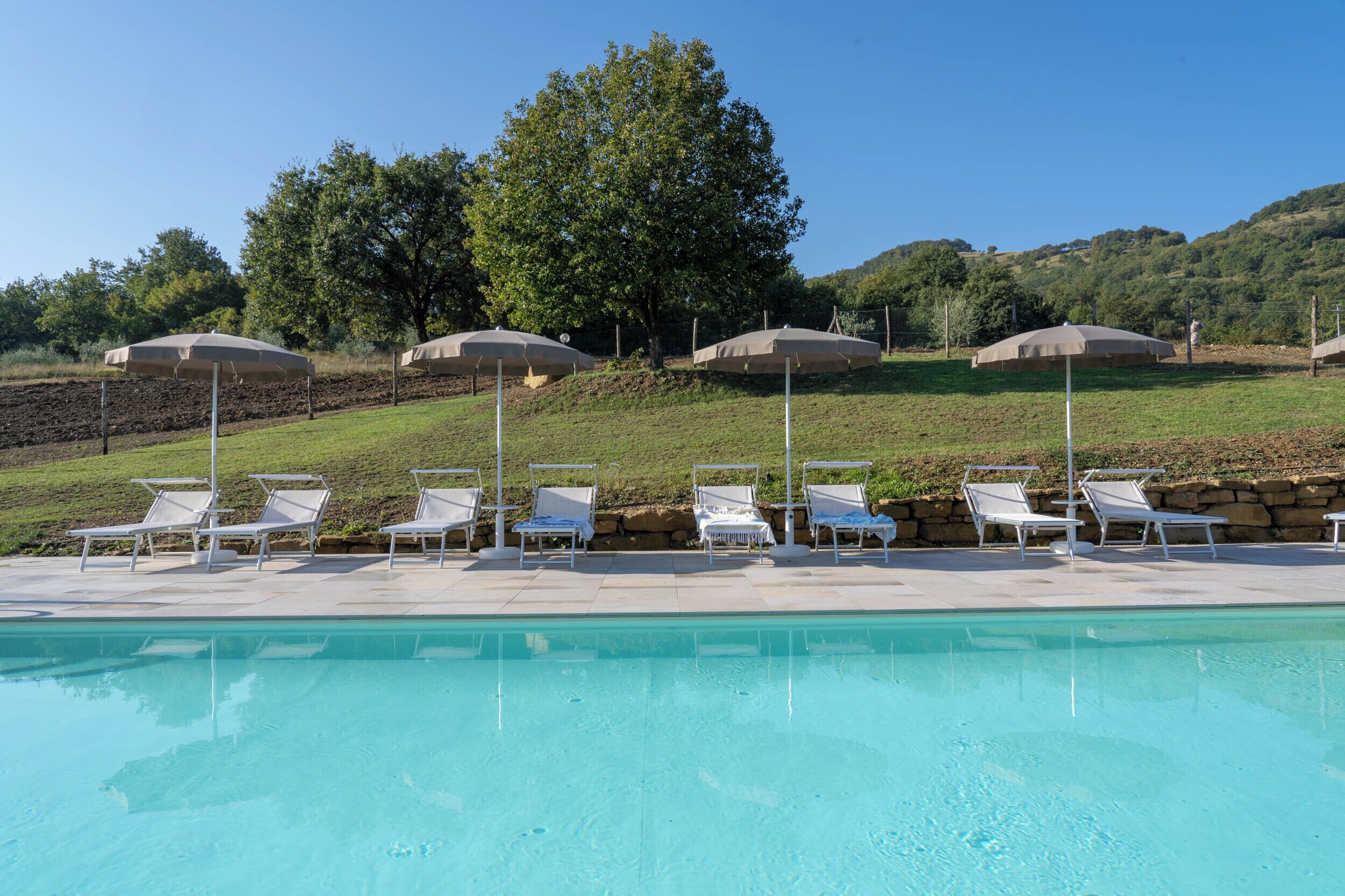 Seasonal outdoor pool, open 9 AM to 8 PM, pool loungers