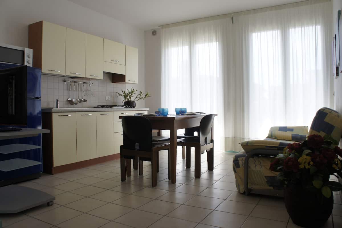 Economy Apartment | Living room | 25-inch LCD TV with cable channels, TV
