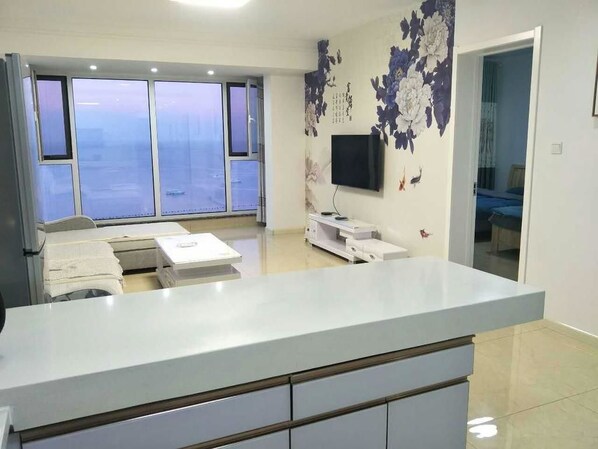 Family Suite | Living area | LCD TV - Weihai Ocean & Sky Apartment Hotel (Weihai)