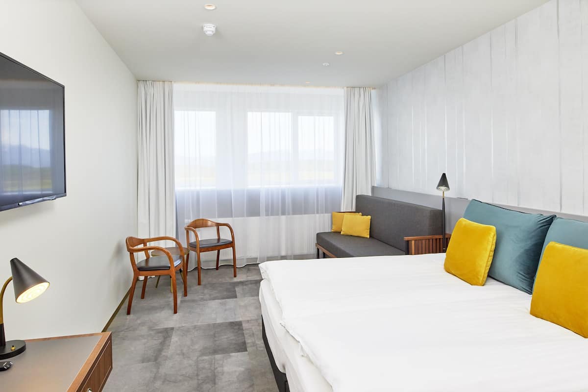 family room | 1 bedroom, desk, blackout curtains, iron/ironing board