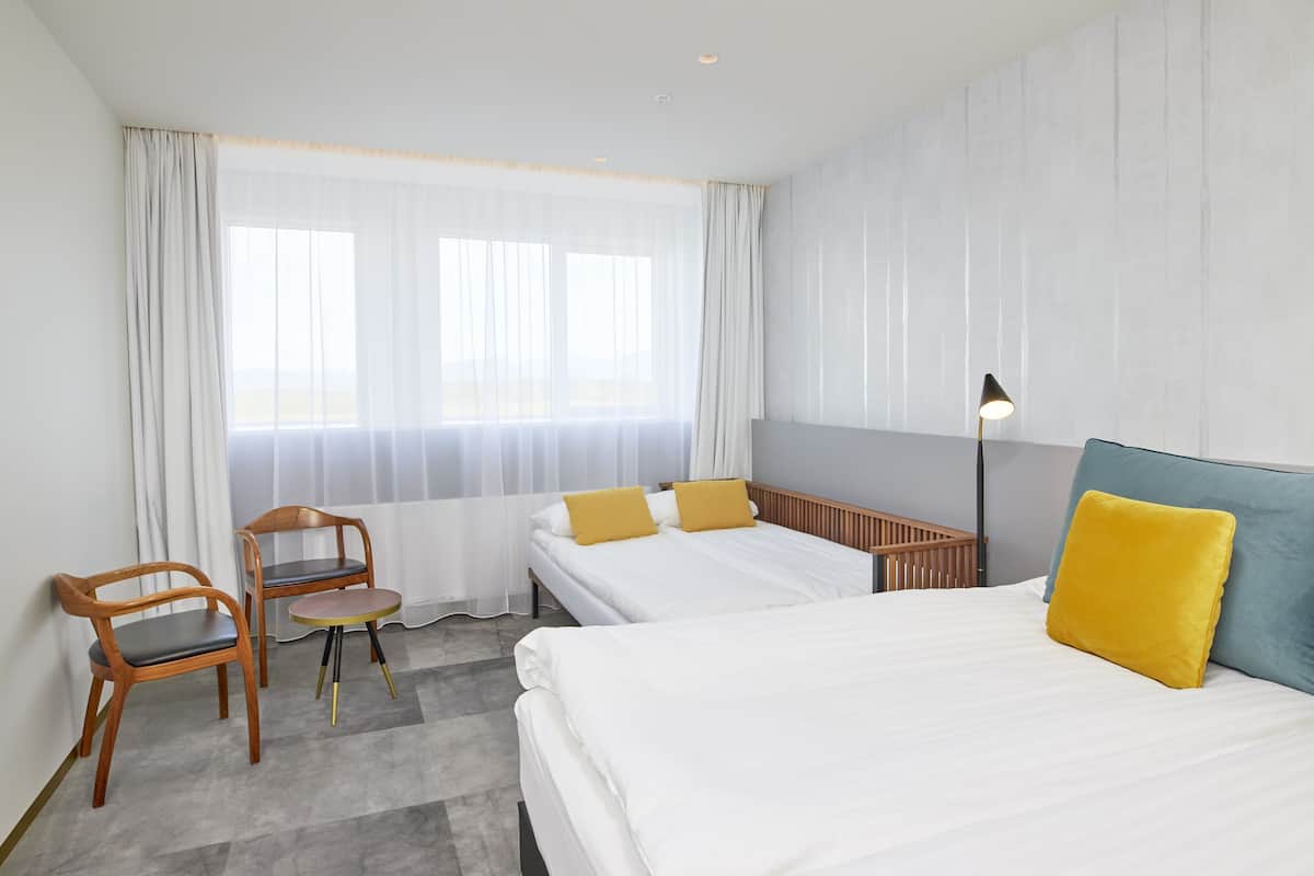 family room | 1 bedroom, desk, blackout curtains, iron/ironing board