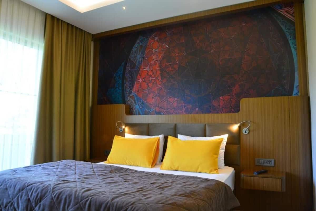 Blackout drapes, soundproofing, iron/ironing board (on request)