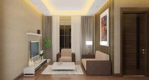 Deluxe Suite, 1 Bedroom | Living area | 55-inch LED TV with satellite channels, TV