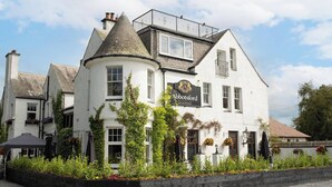 A traditional white building with a sign reading "The Abbotsford Hotel Bar Restaurant." - Abbotsford Hotel (Ayr)