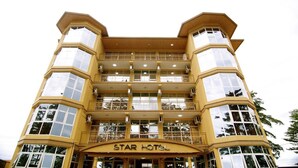 A multi-story hotel with balconies and a central atrium. - Star Hotel (Bujumbura)