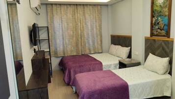 Habitación triple | Wifi gratis y ropa de cama