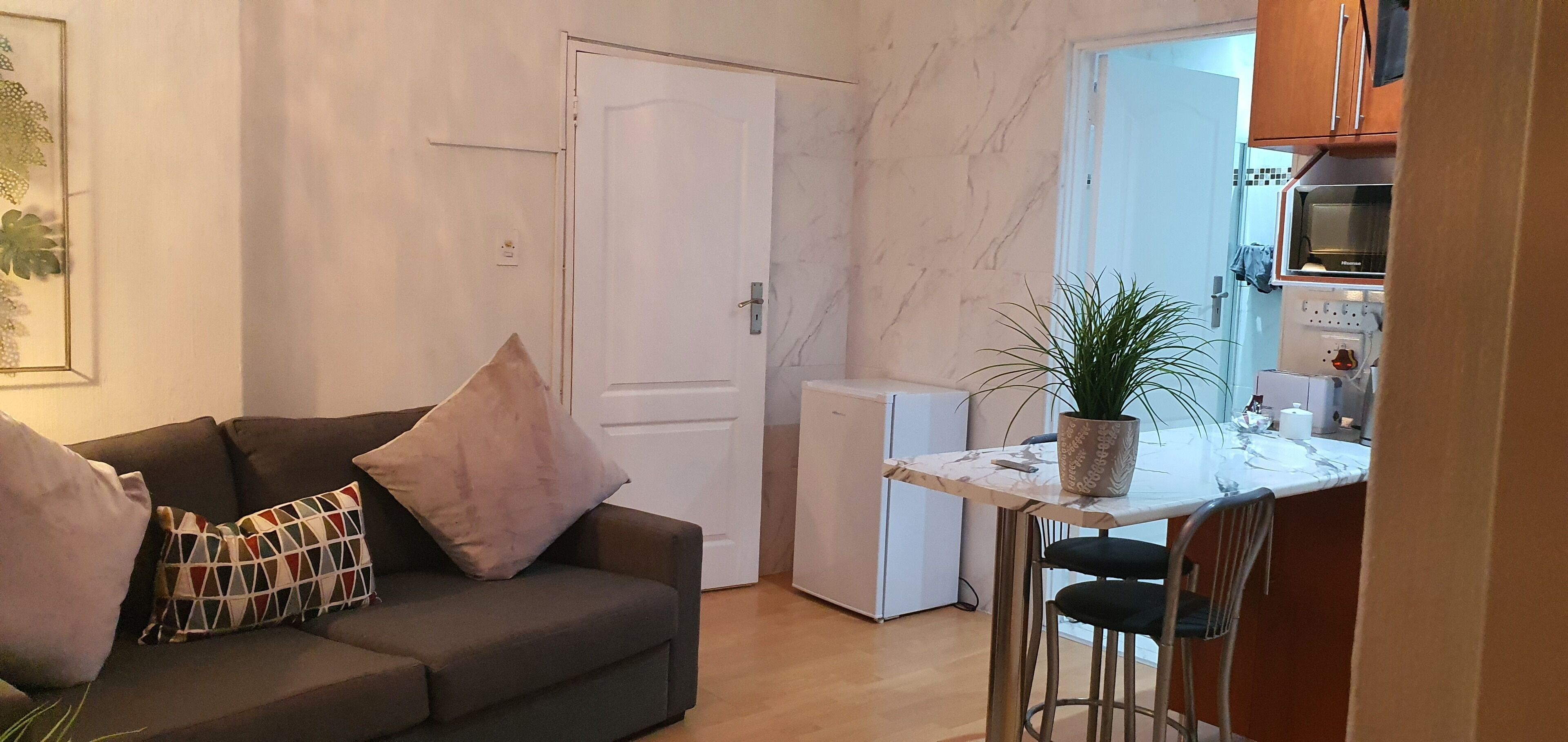 deluxe double room (protea suite) | living area | 32-cm smart tv with digital channels, tv, netflix