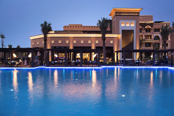Outdoor pool, open 7:00 AM to 6:00 PM, free cabanas, pool umbrellas