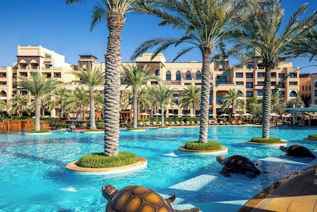 Outdoor pool, open 7:00 AM to 6:00 PM, free pool cabanas, pool umbrellas. Saadiyat Rotana Resort and Villas