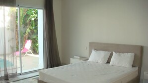 Vila Mewah, 2 kamar tidur, pemandangan kebun | 2 kamar tidur, seprai premium, dan tirai kedap cahaya