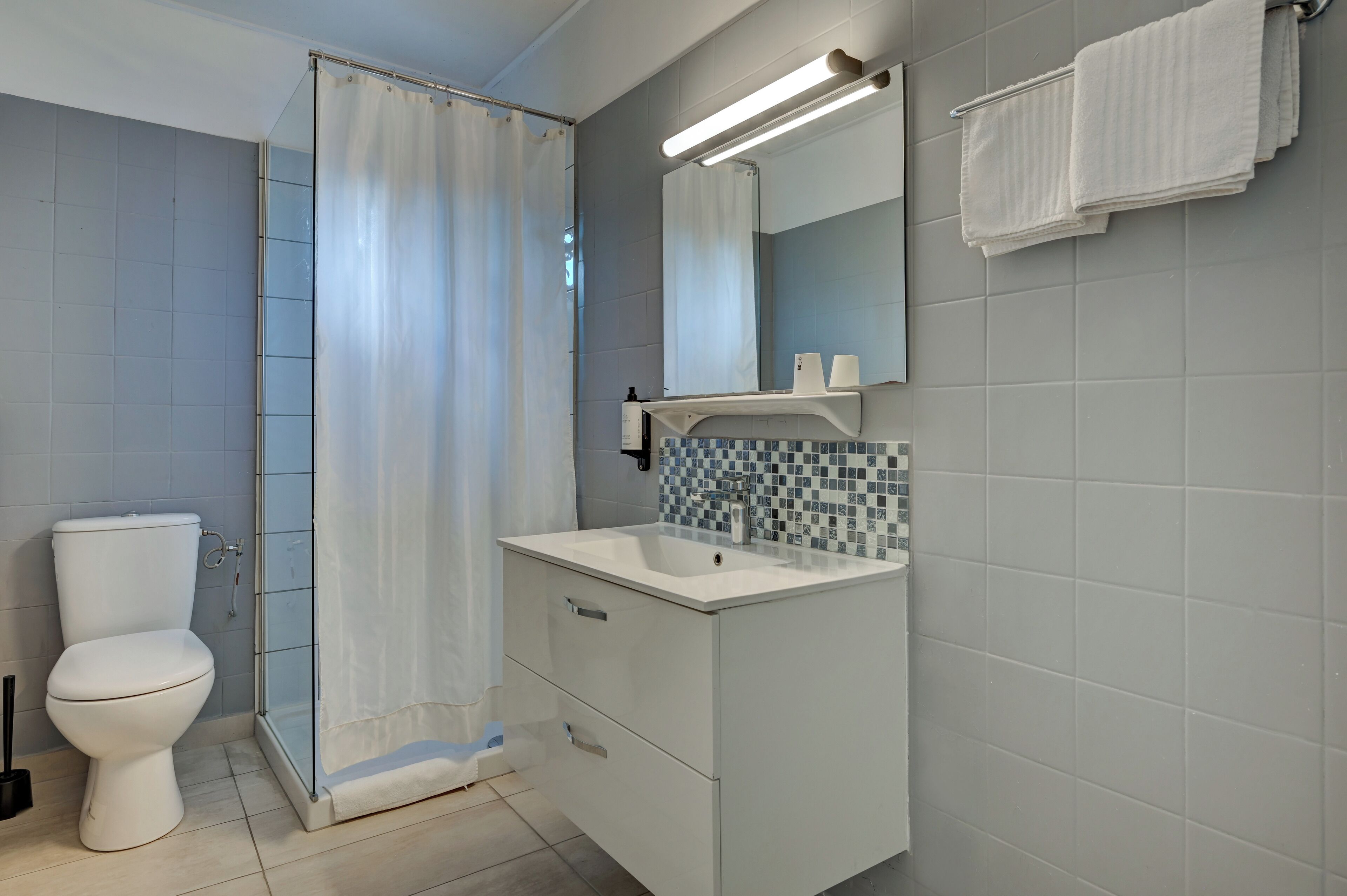 double room, garden view | bathroom | shower, hair dryer, towels, soap